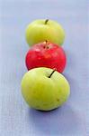 Three apples (two green, one red)