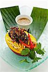 Mango and quail salad with coriander and peanut sauce (Asia)