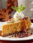 Slice of Pumpkin Cheesecake with Whipped Cream