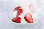 Yogurt ice cream, garnished with fresh strawberries