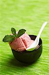 Strawberry ice cream with fresh mint