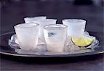 Frozen Vodka Shots on a Tray with Lime