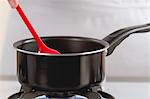 A saucepan on a gas stove