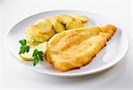 Breaded fish fillet with fried potatoes