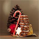 A Christmas arrangement of decorations and cinnamon biscuits