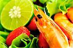 A mixed salad with prawns and limes (close-up)