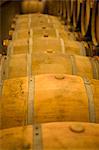 Wooden barrels in a wine cellar (Chateau Lynch-Bages, Frankreich)