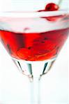 A glass of redcurrant liqueur (close-up)