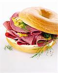 Bagel with cream cheese, cured beef, mustard and dill