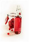 Fresh raspberries and a bottle of raspberry liqueur