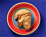 Beef Filled Pastries on a Colorful Plate; From Above