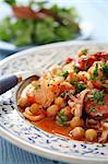 Chickpea stew with seafood and chorizo