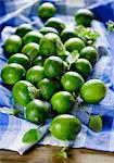 Limes and mint leaves on a cloth