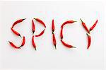 The word 'SPICY' written in red chillies