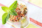 Couscous tabbouleh with vegetables, raisins and mint