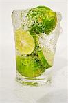 Limes in a glass of water