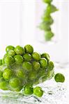 Frozen peas in a block of ice