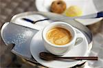 Espresso, a sugar tin and Italian biscuits