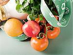 Canvas Shopping Bag with Tomatoes, Fruit and a Bottle of Milk