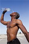 Athlete pouring water on himself