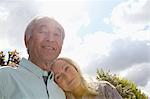 Older couple standing outside together