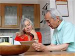 Older couple using tablet computer