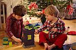 Boys opening Christmas gifts