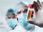 Scientist examining test tube in lab