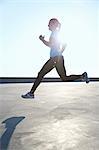 Woman running on rooftop