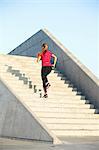 Woman running on staircase