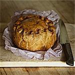 Baked pork pie on wooden board