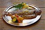 Plate of grilled plaice and vegetables
