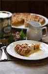 Slice of treacle tart with cream