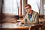 Man drinking tea in a restaurant