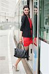 Woman boarding a bus