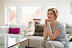 Woman sitting on a couch and looking away