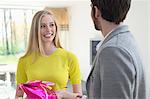 Woman receiving gift from boyfriend