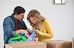 Couple looking into a laundry basket