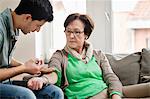 Male doctor giving an injection to a patient