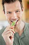 Man eating an artichoke