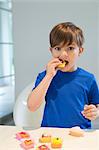 Boy eating a cup cake