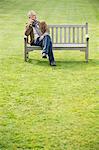 Man sitting on a bench and thinking in a park