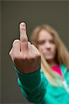 Girl showing middle finger