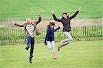 Happy family having fun in a field