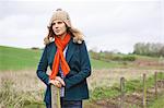 Beautiful woman standing in a field