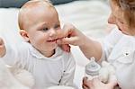 Woman playing with her daughter and smiling