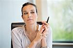 Close-up of a businesswoman thinking in an office