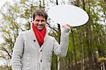 Man holding a speech bubble