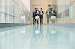 Business executives walking in a corridor