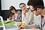 Fashion designers working in an office